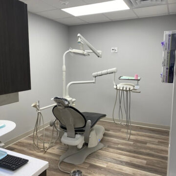 Dental treatment room with dental chair and equipment