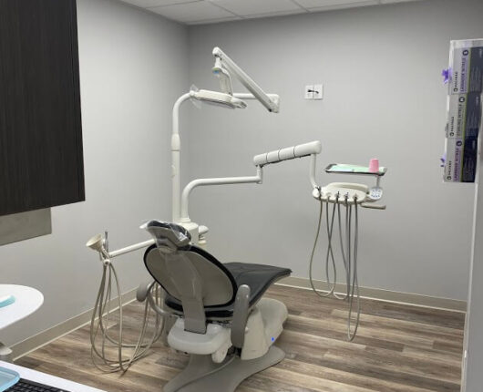 Dental treatment room with dental chair and equipment